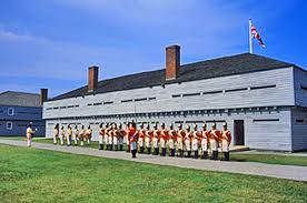 Fort George National Historic Site in Niagara-on-the-Lake: Historic buildings with a flag pole and re-enactors.