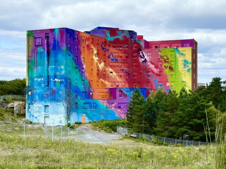 Sudbury, Northern Ontario: A view of the Big Nickel landmark with trees and sky.